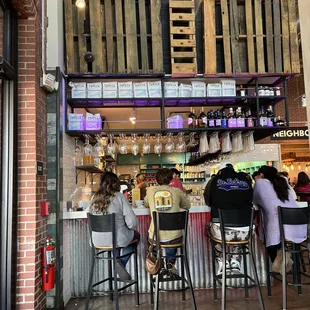 people sitting at a bar