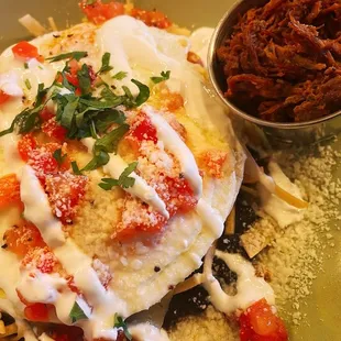 a plate of food and a bowl of sauce