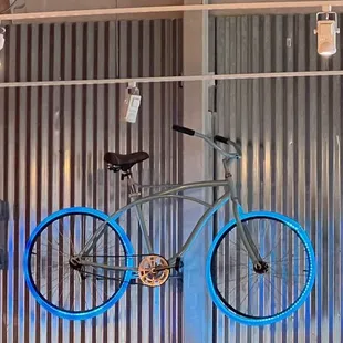a bicycle hanging from the ceiling