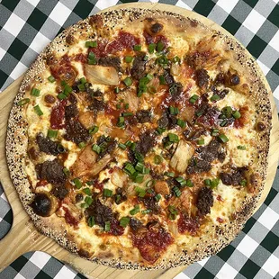 Rotating Pizza Lab: &quot;Go Go Bulgogi&quot; 
 
 Gochujang-infused red sauce with aged mozz, beef bulgogi, kimchi, &amp; green onion with sesame seed rim