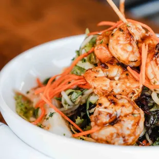 a bowl of shrimp and vegetables