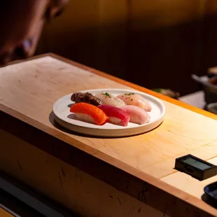 a plate of sushi on a counter