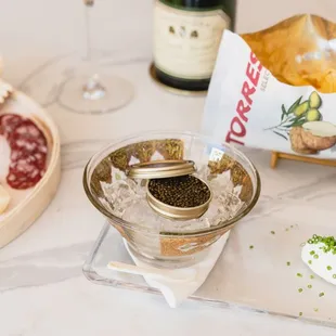 a plate of food and a glass of wine