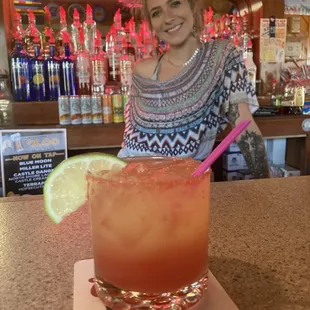 This bartender makes a tasty summer cocktail.