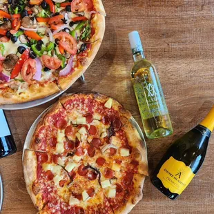 Pizza Uncorked! A medium Artisan Pizza with a bottle of wine for $35 on Mondays and Tuesdays!