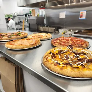 A few of our Artisan pizzas! We make our dough in house every day!