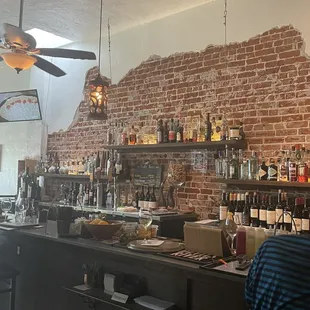 a man sitting at a bar in a restaurant