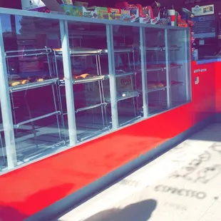 a man standing in front of a deli counter