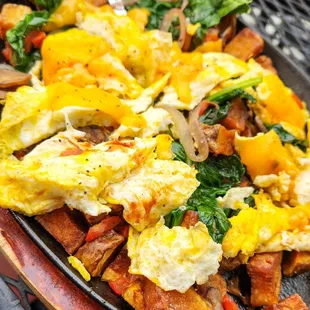 Farmers market skillet with light cheese - veggies over crispy potatoes topped with scrambled eggs and cheese