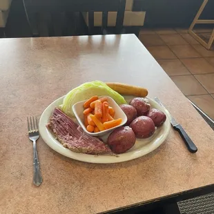 a plate of meat and vegetables