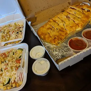 Two house salads and a stromboli!!! Delicious!!!
