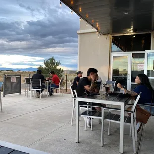 a group of people sitting outside