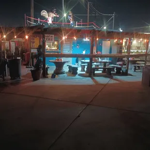 Neil's at night after closing ,with his new addition ,the new dining bar, ,it's really neat, ,grab a seat ., Getcha something good to eat!