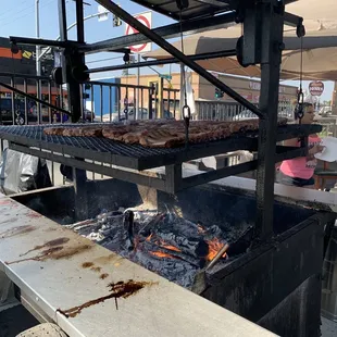 a grill with meat on it