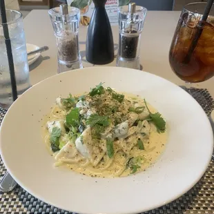 Lemon butter crab pasta with spinach and cilantro. Tastes delicious. Reminds me of the beach!