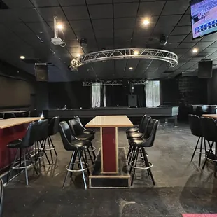 Stage for the bands and large tables for larger groups.