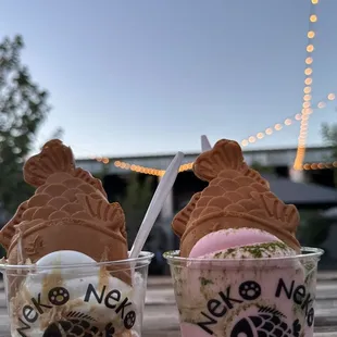 two ice cream sundaes on a table