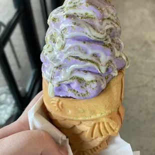Taiyaki cone! This one has red bean filling, ube flavor soft serve, matcha powder, and condensed milk drizzle!