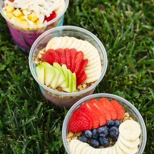 three cups of fruit and yogurt