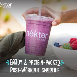 a person holding a smoothie