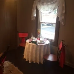 a dining room with a table and chairs