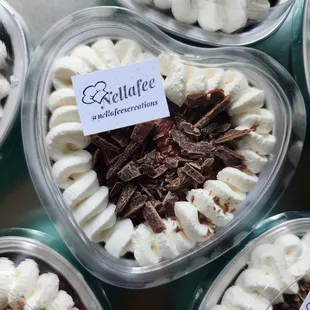 a variety of desserts in plastic containers