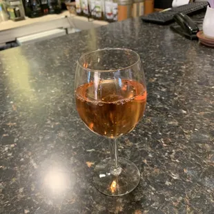 a glass of rose wine