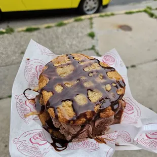 This is the cookie sandwich with chocolate chip cookies and chocolate ice cream and a chocolate and caramel drizzle.