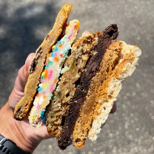 a hand holding a sandwich