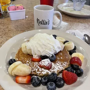 a plate of pancakes and fruit