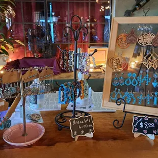 Jewelry for sale on 7/29/23. $6 bracelets. $8 earrings.