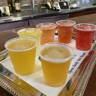 a variety of drinks on a tray
