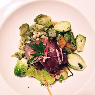 Braised lamb leg with nettles, white beans, brussel sprouts and rosemary