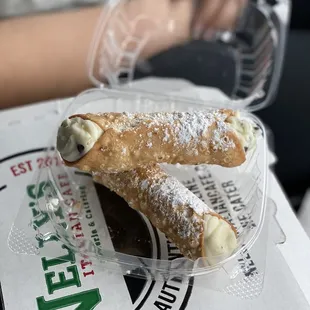 two pastries in a plastic container