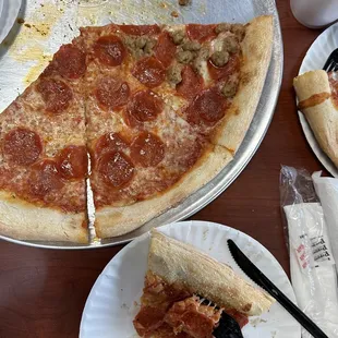 What&apos;s left of 1/2 pepperoni, 1/2 sausage pizza.