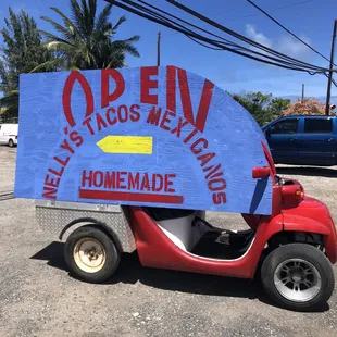 a cart with a sign on it