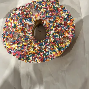 XL white iced sprinkled donut