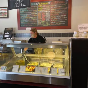 a woman behind the counter