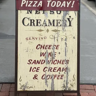 a sign on the sidewalk