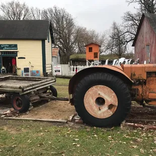 Tractor to climb on, small Playground in back,gift shop in cream bldg