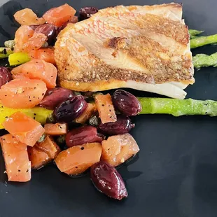 a plate of fish and vegetables