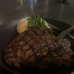 a steak and mashed potatoes on a plate