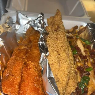 a tray of fried fish and fries