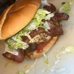 a burger with lettuce and bacon