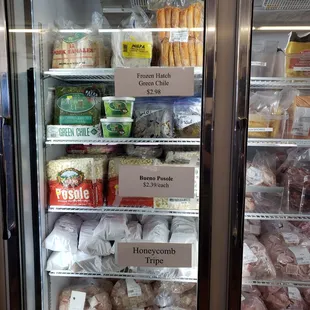 a refrigerator full of meats