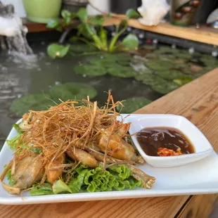 Frog under straw stack