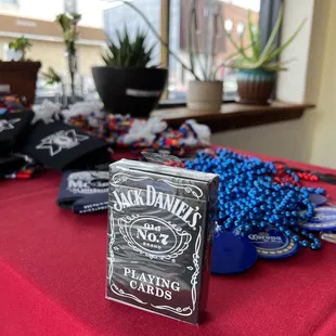 a table with a red table cloth and a sign that says jack daniels