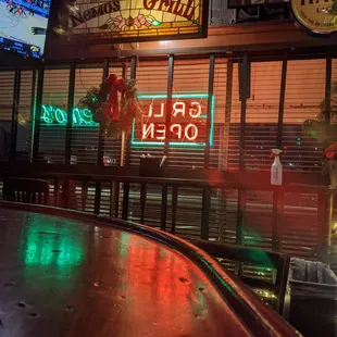a bar with neon signs
