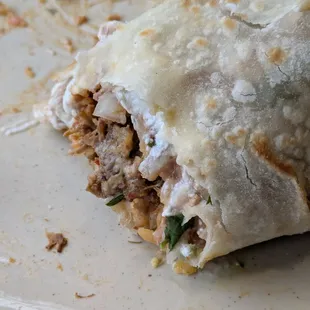 The super burrito with birria - my enchiladas verdes was already long gone.