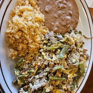 Breakfast nopales carnitas with eggs beans and rices Big portions and delicious
